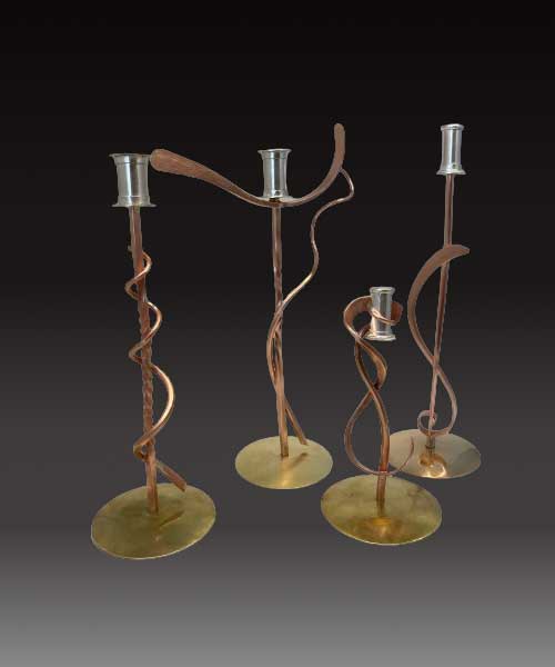 Photo of candlesticks made by students in the James Carter Jewelry Making Class learning metalsmithing.